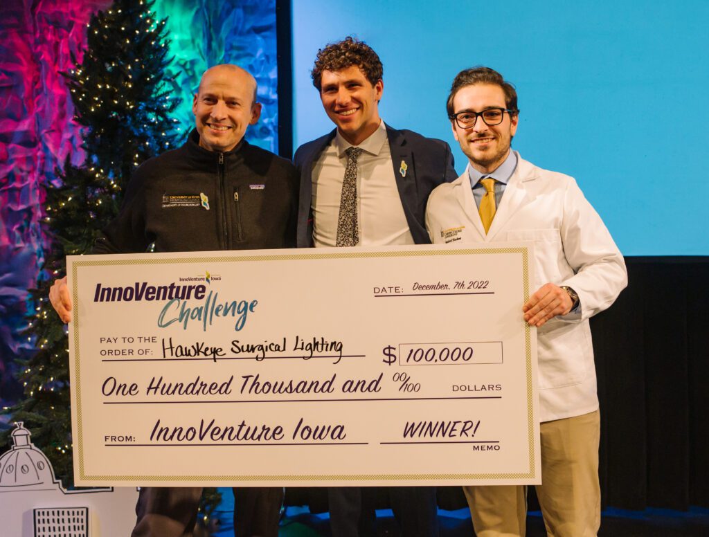Winners of the InnoVenture Challenge holding a check